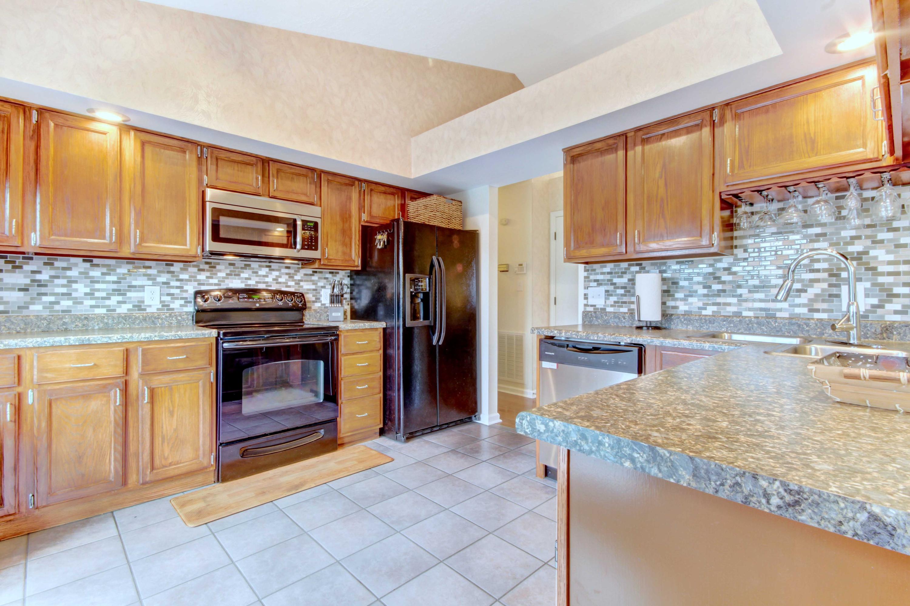 3355 Turner Branch Road Vinton, VA 24179 - Photo 7 of 58 a kitchen with stainless steel appliances granite countertop a stove a sink and a microwave