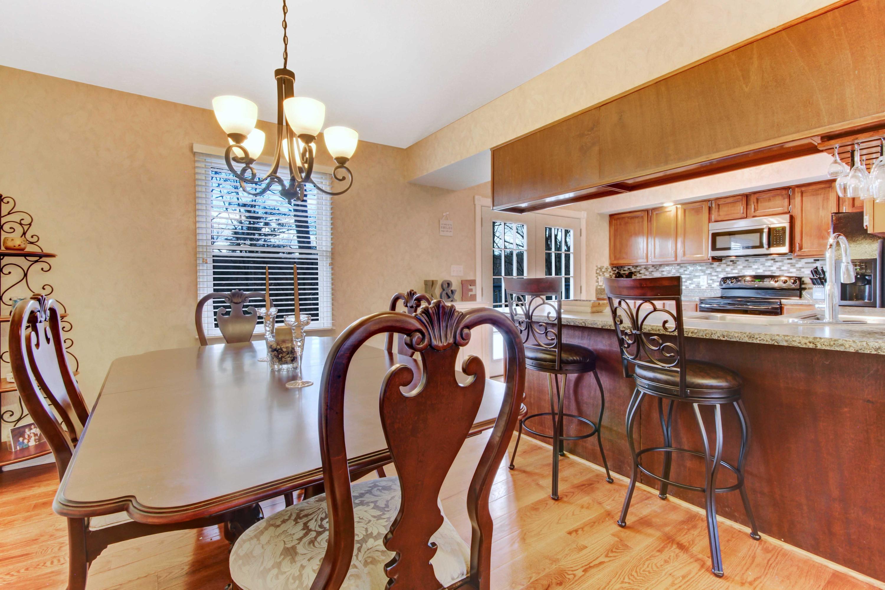 3355 Turner Branch Road Vinton, VA 24179 - Photo 10 of 58 a dining room filled chandelier and wooden floor