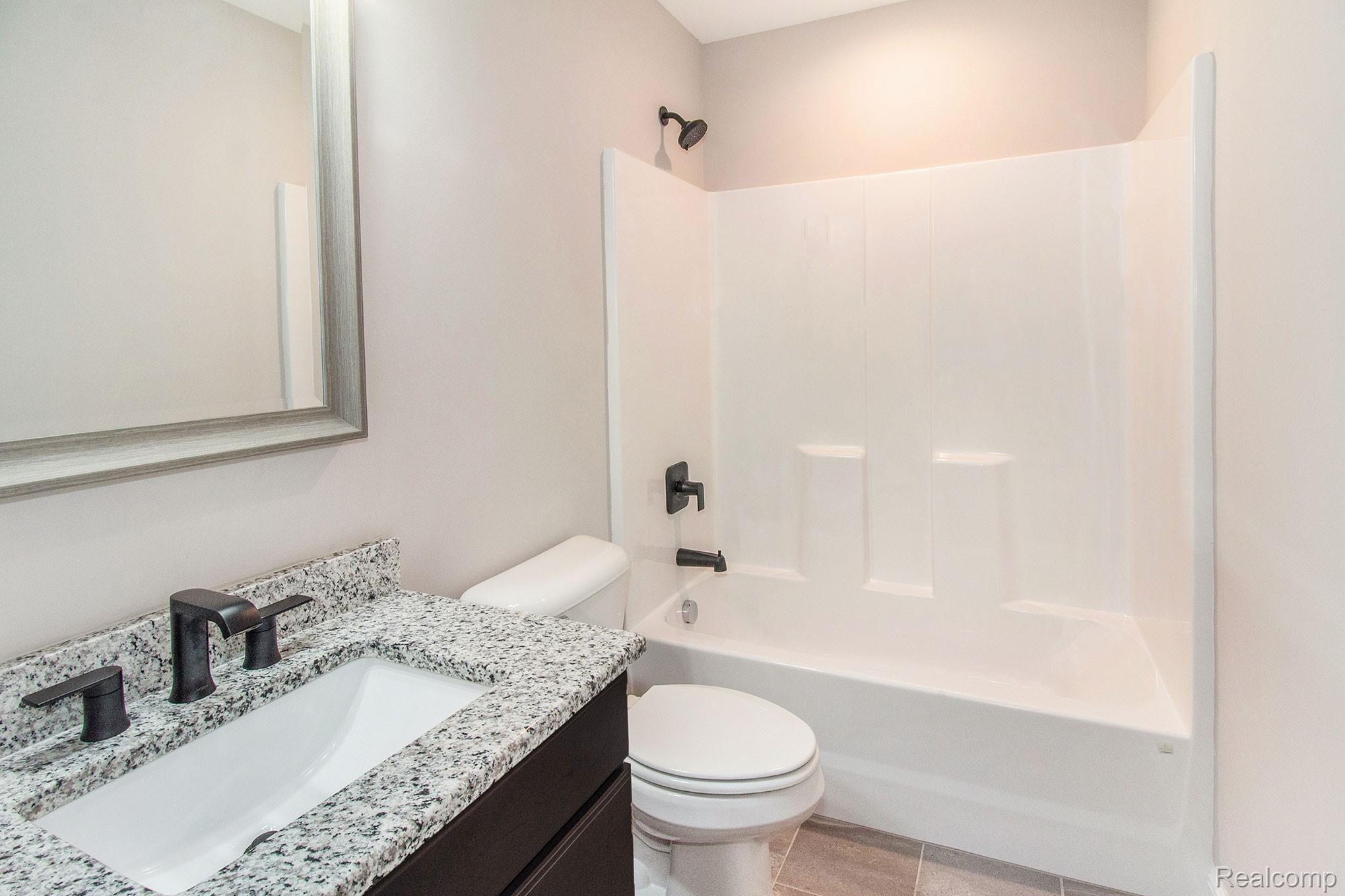 5885 Chilson Road Howell, MI 48843 - Photo 22 of 38 Upstairs Bathroom