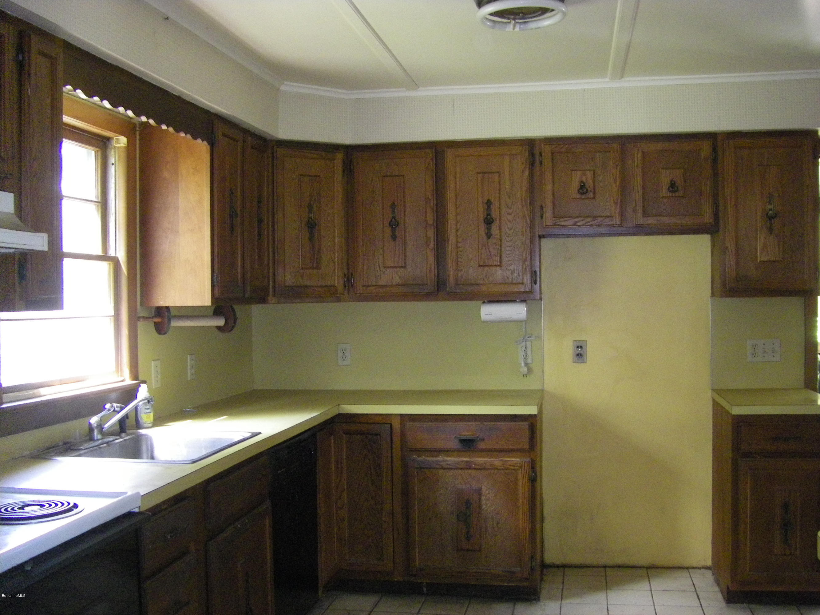 401 Cross Road Clarksburg, MA 01247 - Photo 12 of 26 a kitchen with a sink and cabinets