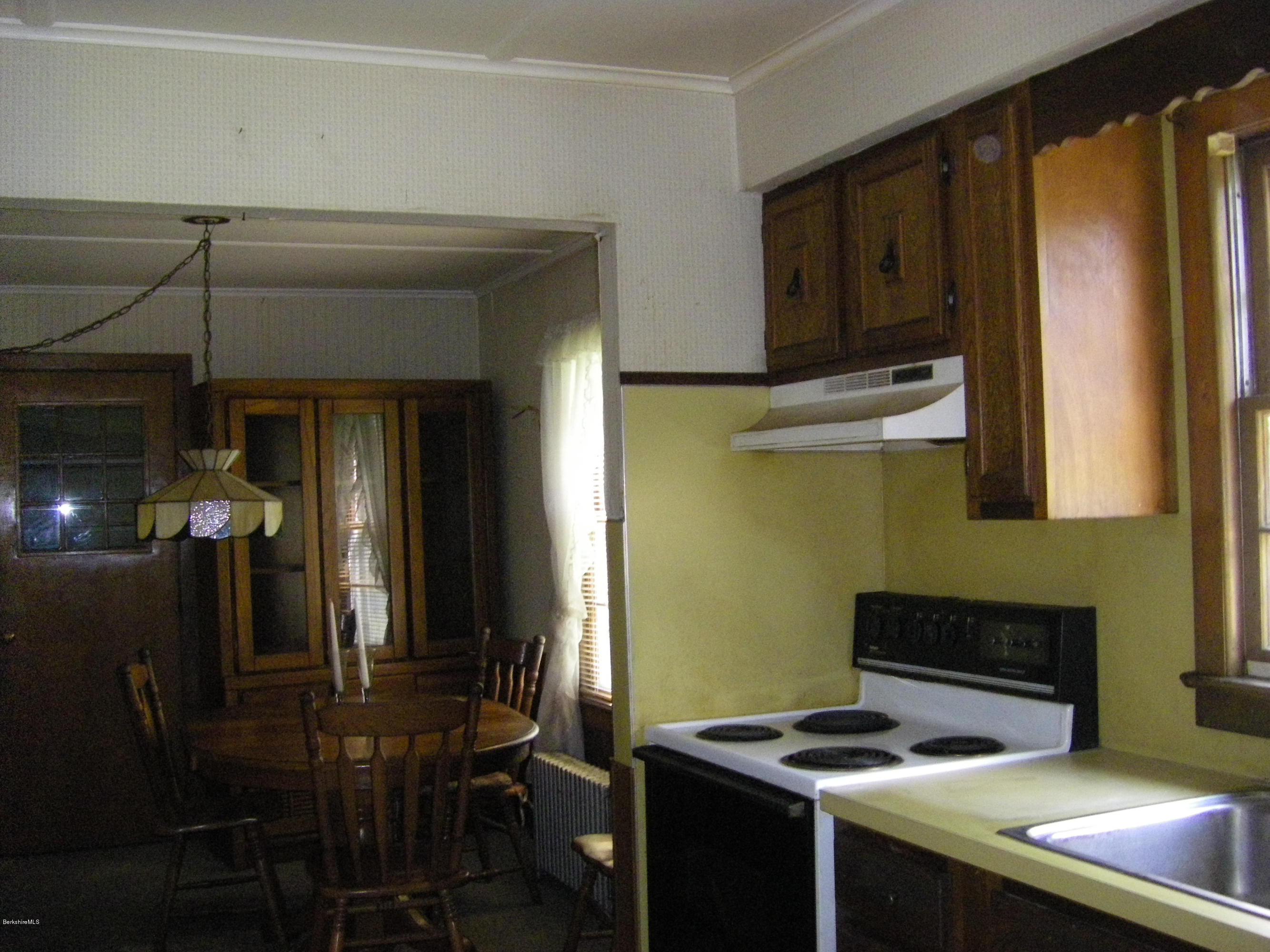 401 Cross Road Clarksburg, MA 01247 - Photo 14 of 26 a kitchen with stainless steel appliances a stove a microwave and a refrigerator