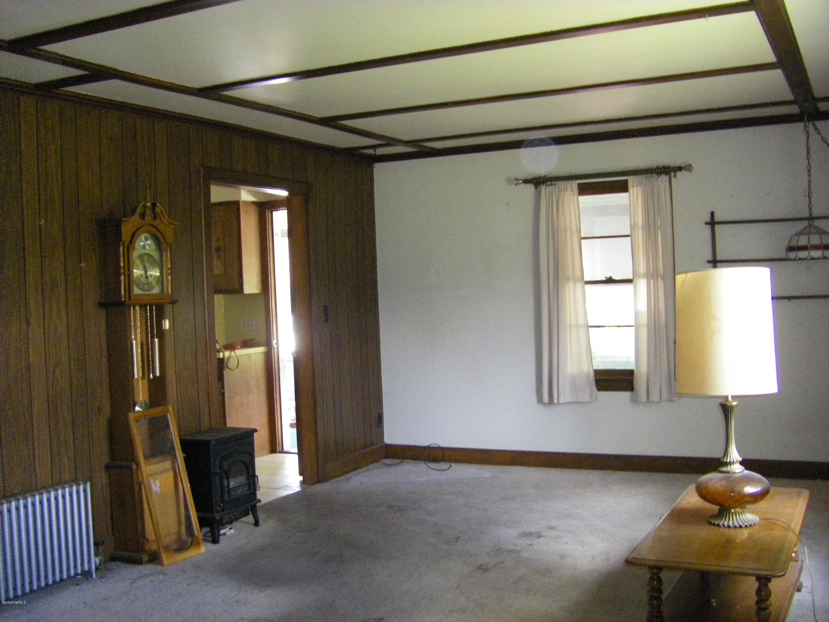 401 Cross Road Clarksburg, MA 01247 - Photo 19 of 26 a front view of a house with wooden floor and a mirror
