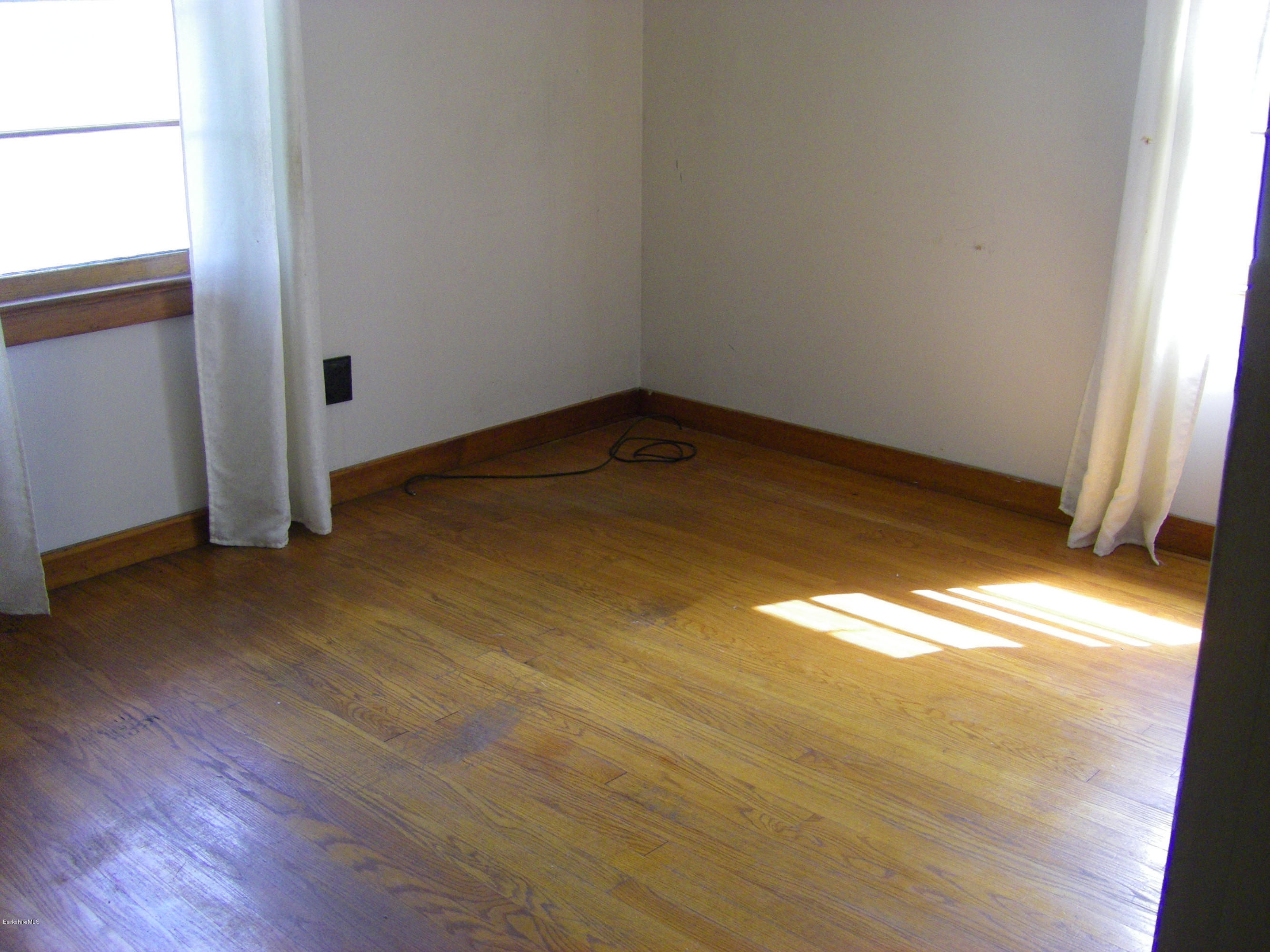 401 Cross Road Clarksburg, MA 01247 - Photo 21 of 26 a view of empty room with wooden floor