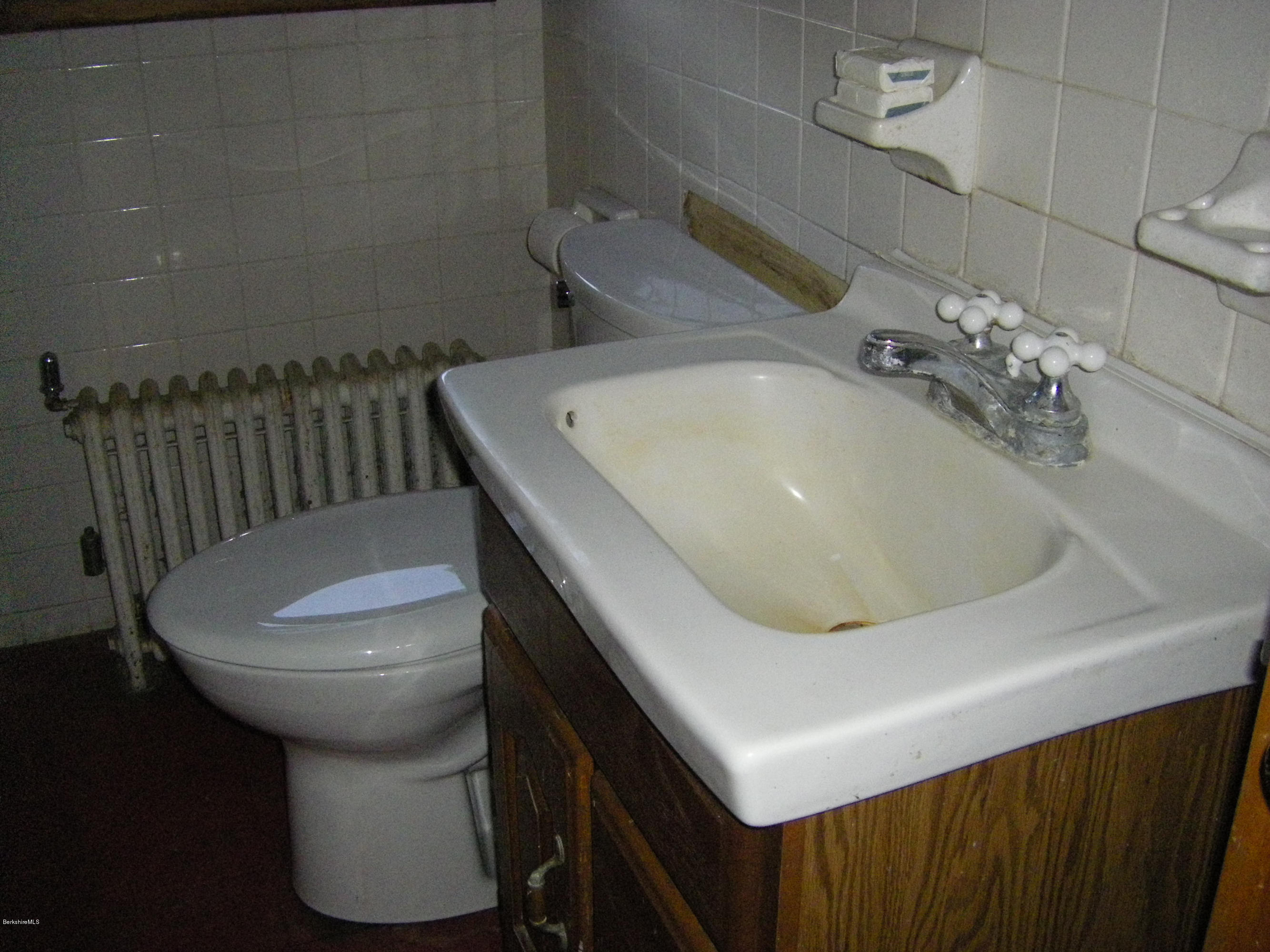 401 Cross Road Clarksburg, MA 01247 - Photo 24 of 26 a bathroom with a sink and toilet