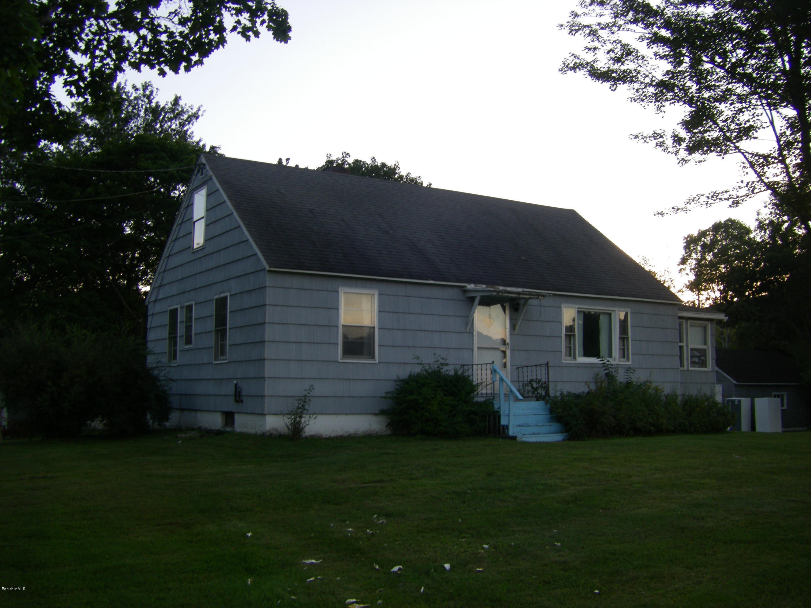 401 Cross Road Clarksburg, MA 01247 - Photo 4 of 26 a brick house with a small yard