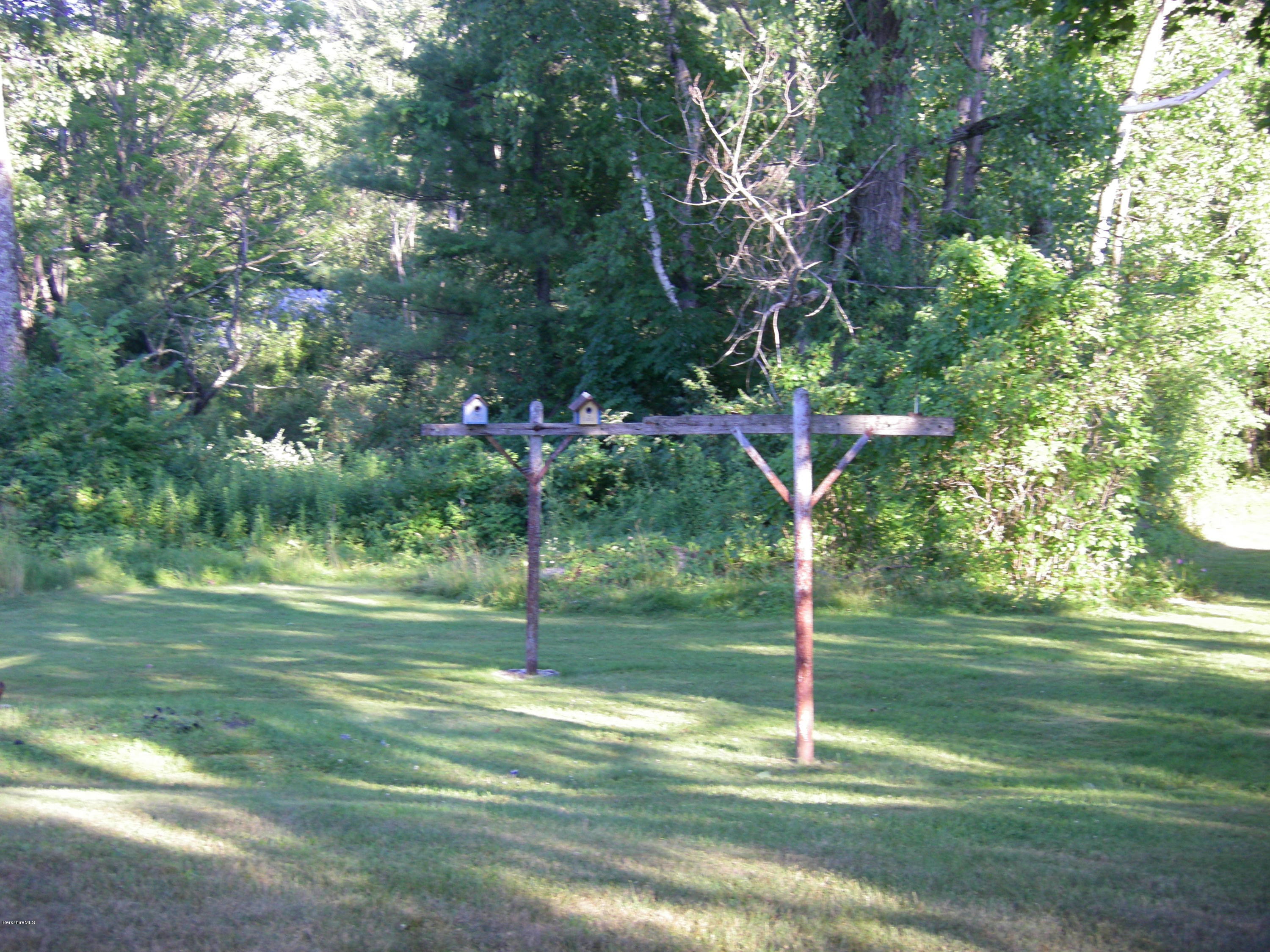 401 Cross Road Clarksburg, MA 01247 - Photo 8 of 26 a backyard of a house with lots of green space