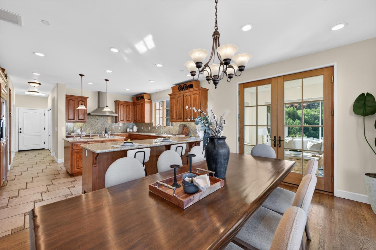 17599 Montebello Road Cupertino, CA 95014 - Photo 16 of 83 a living room with kitchen island furniture and a chandelier