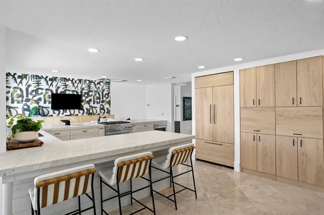a hallway with a couch and a potted plant