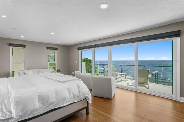 a bathroom with a bathtub sink and mirror