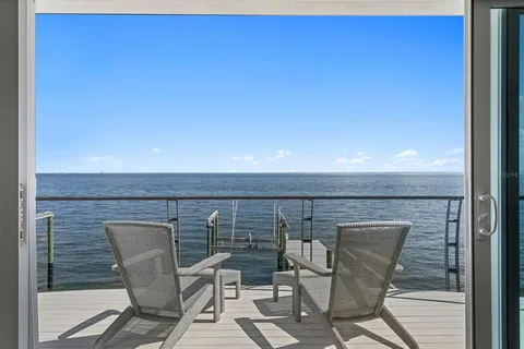 a terrace with outdoor seating and city view