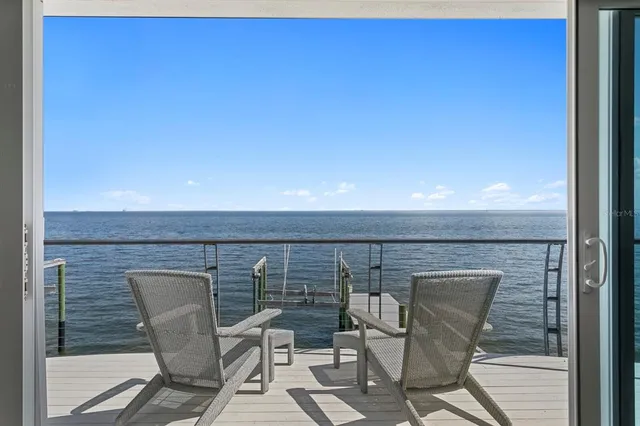a terrace with outdoor seating and city view