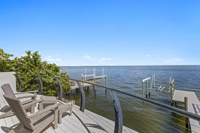 a balcony with furniture and city view