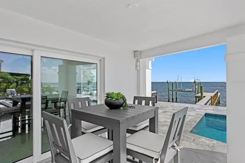 a view of a patio with swimming pool
