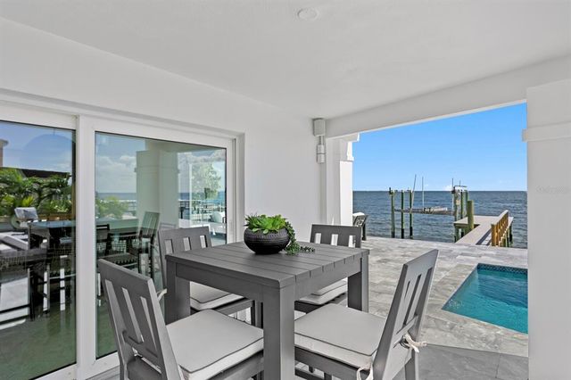 a view of a patio with swimming pool