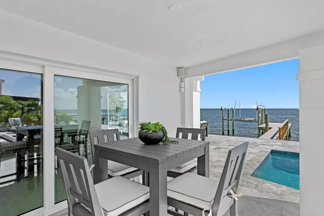 a view of a patio with swimming pool