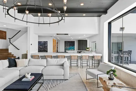 a kitchen with stainless steel appliances a stove and a sink