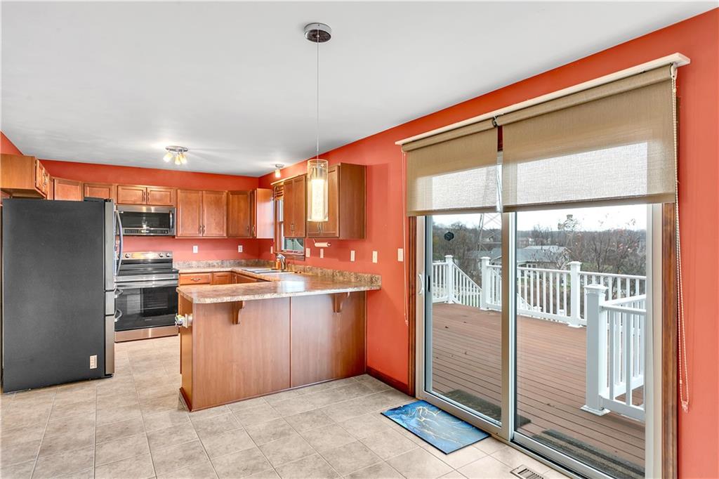 146 Rustic Ridge Drive Pittsburgh, PA 15239 - Photo 8 of 34 With additional seating at the peninsula, the eat-in kitchen offers plenty of space...