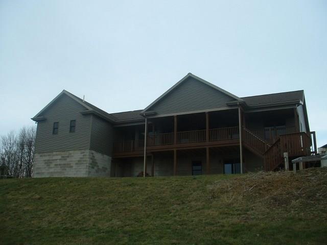 162 Cemetery Road Dayton, PA 16222 - Photo 3 of 21 Large Covered Deck has access from Master Bedroom Suite and Family Room. Excellent View of Country Side that leads down to above ground swimming pool.