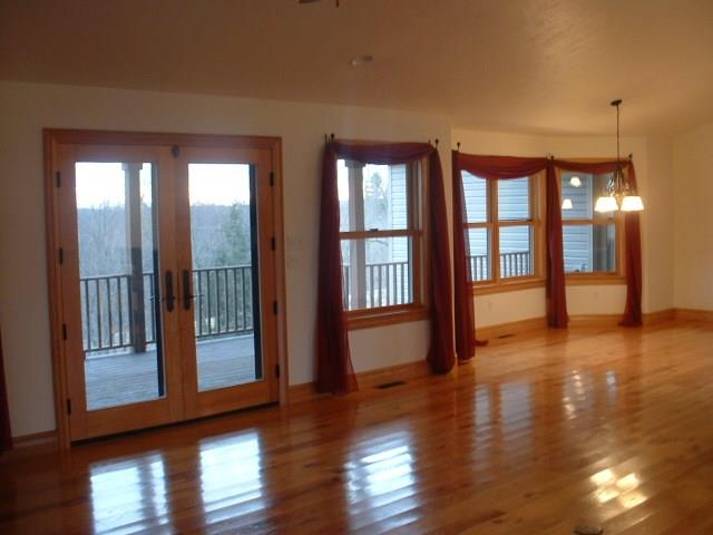 162 Cemetery Road Dayton, PA 16222 - Photo 6 of 21 Spacious Living Room, Dining Room all Custom Red Oak Flooring and Trim that opens to Large Deck overseeing Hills and Pastures - Entertain and Relax on the Covered Desk as the Sun Sets