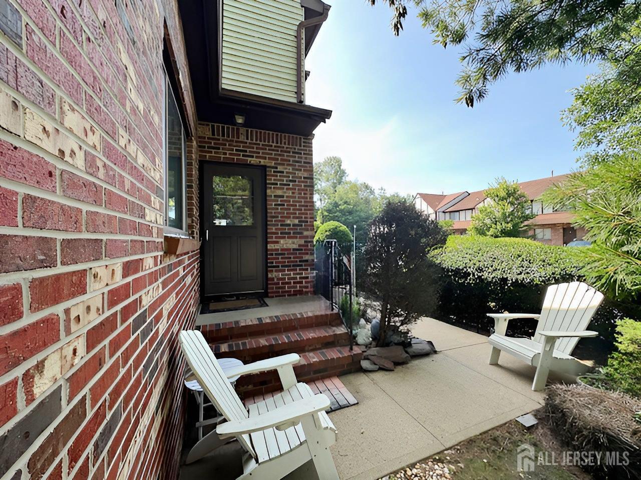 2 Devonshire Court Ewing, NJ 08628 - Photo 2 of 25 a front view of a house with a garden