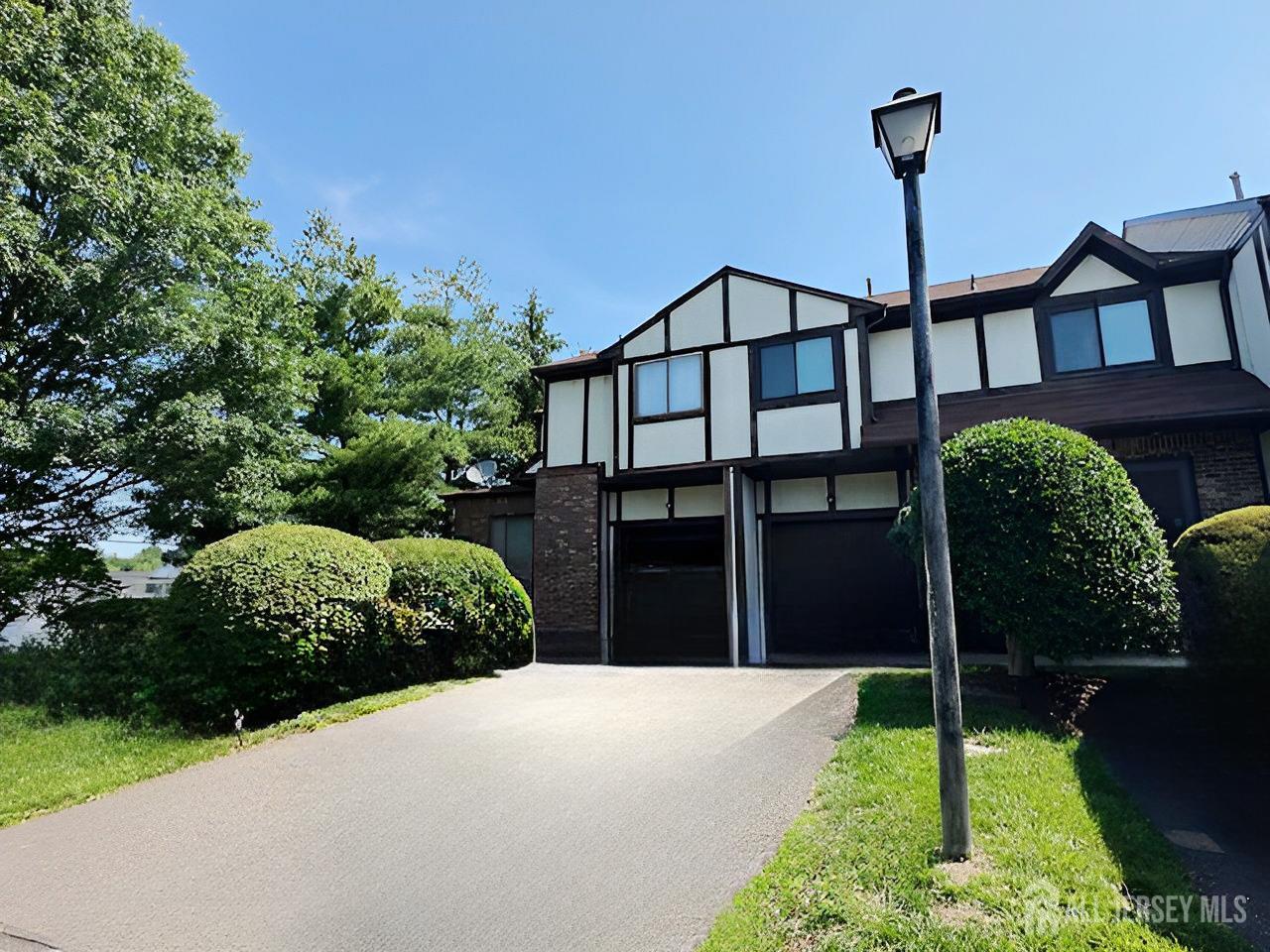 2 Devonshire Court Ewing, NJ 08628 - Photo 24 of 25 a house view with a garden space