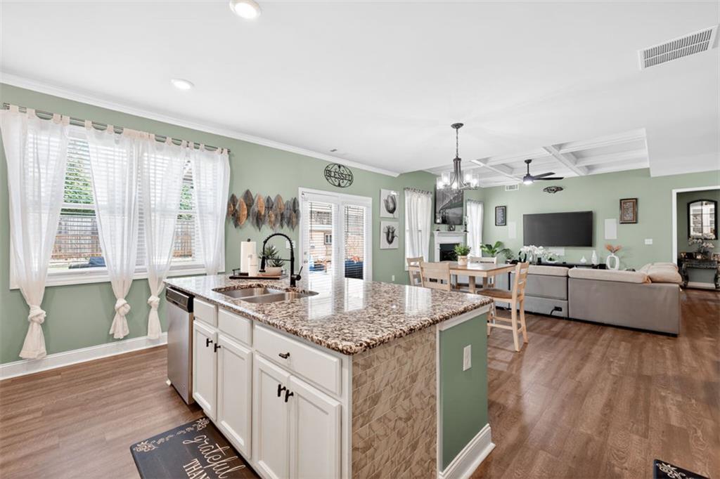 4479 Big Rock Rdg Trail Gainesville, GA 30504 - Photo 14 of 45 a hall with kitchen island granite countertop a sink and a stove top oven