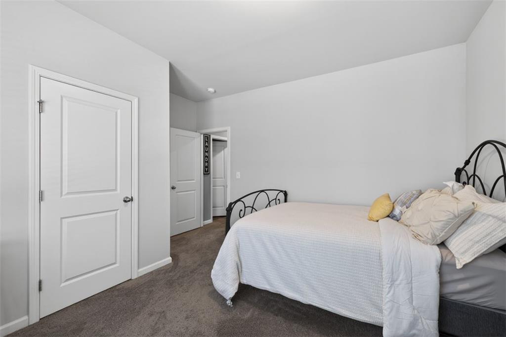 4479 Big Rock Rdg Trail Gainesville, GA 30504 - Photo 24 of 45 a bedroom with a bed and hallway