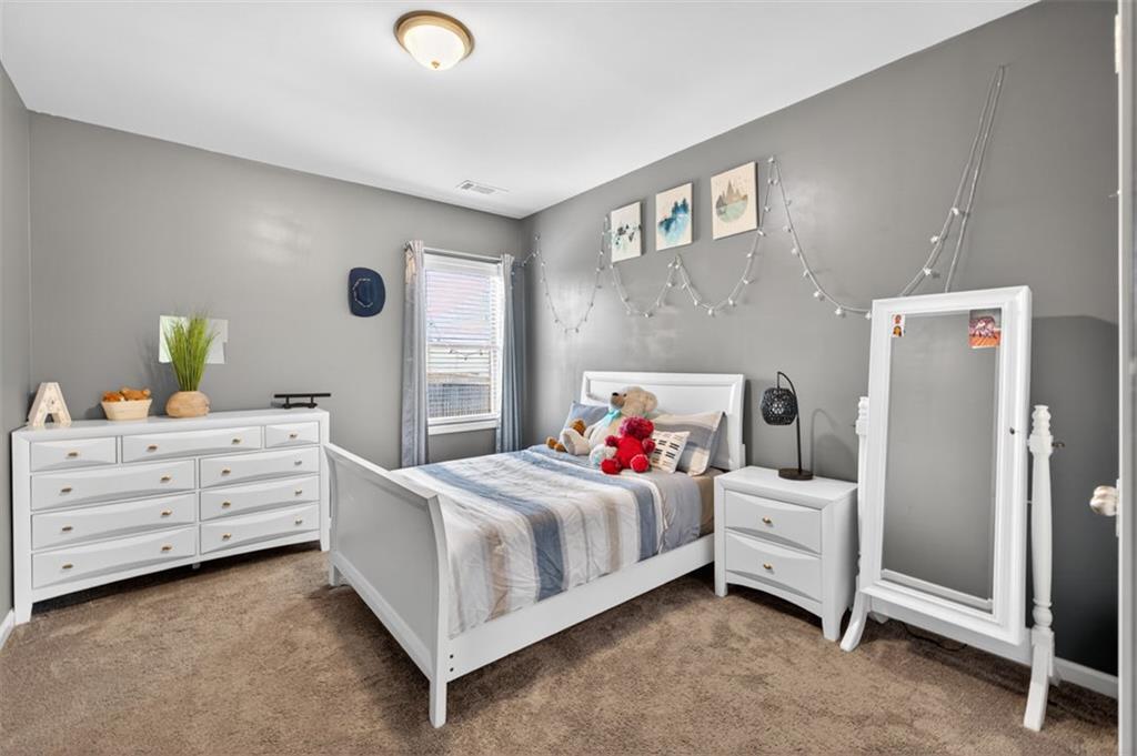 4479 Big Rock Rdg Trail Gainesville, GA 30504 - Photo 27 of 45 a bedroom with a bed and a dresser