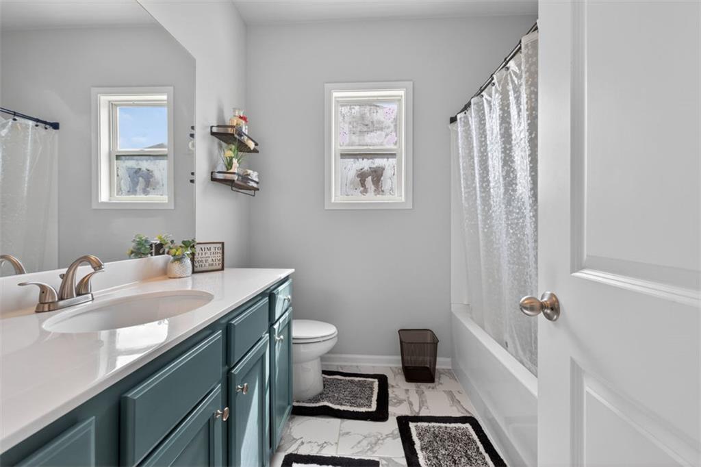4479 Big Rock Rdg Trail Gainesville, GA 30504 - Photo 28 of 45 a bathroom with a sink toilet and shower