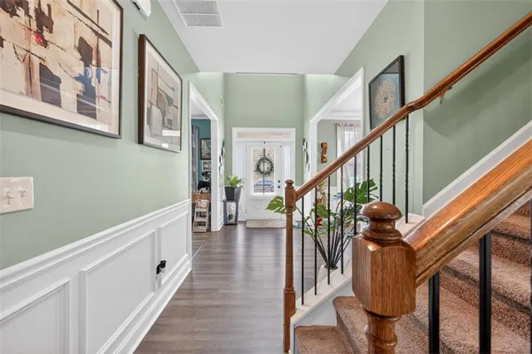 a view of an entryway with wooden floor