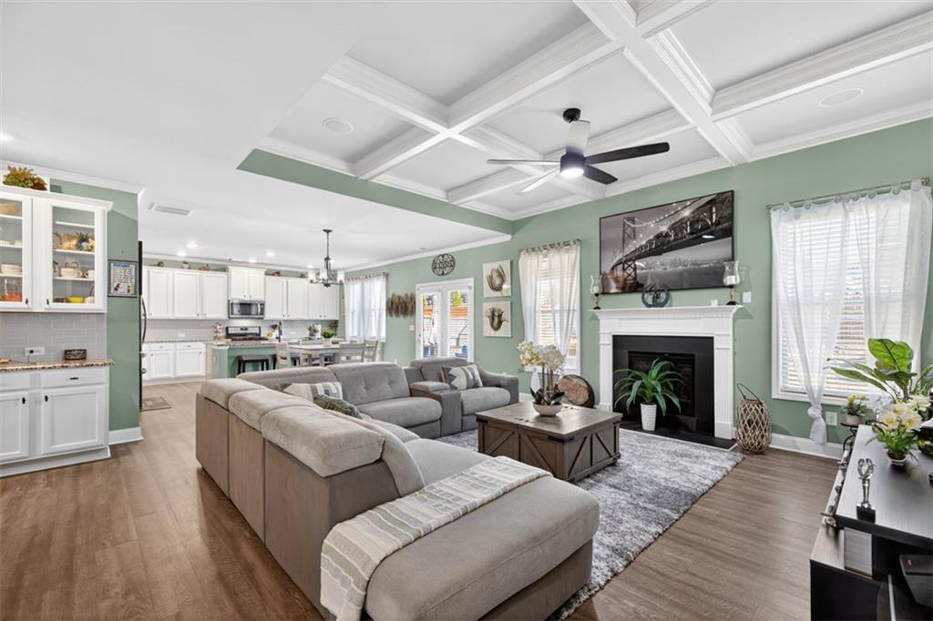 4479 Big Rock Rdg Trail Gainesville, GA 30504 - Photo 8 of 45 a living room with furniture fireplace and wooden floor