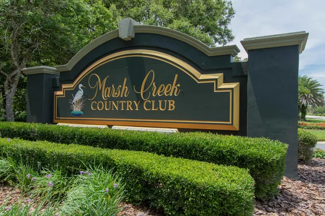 a view of balcony with chairs and wooden fence