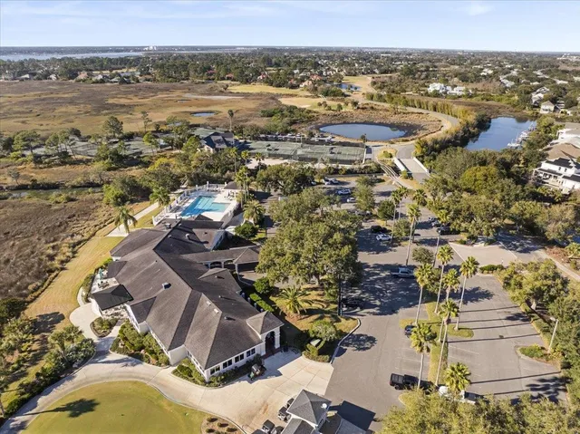 a view of house with outdoor space and trees