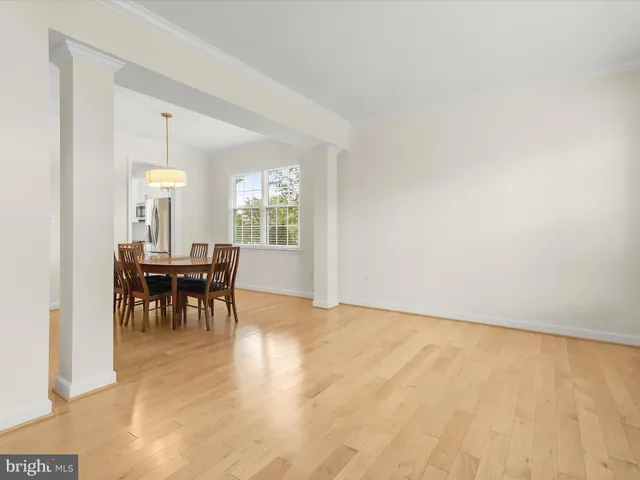 a kitchen with granite countertop white cabinets white appliances