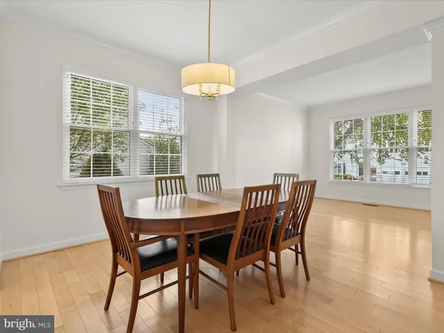 a kitchen with granite countertop a refrigerator oven a sink and cabinets