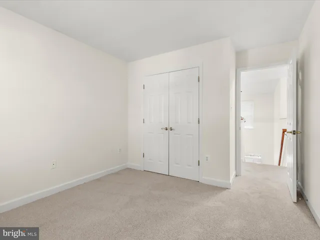 a view of chairs and tables in the park