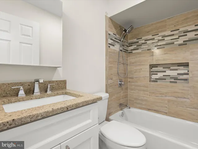 a view of a house with backyard porch and sitting area