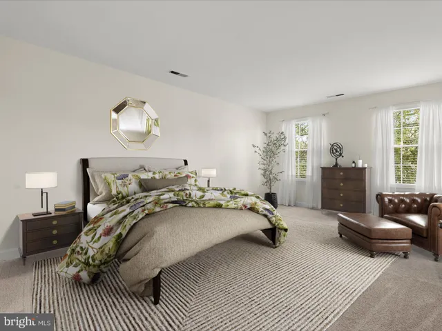 a living room with furniture and a lamp