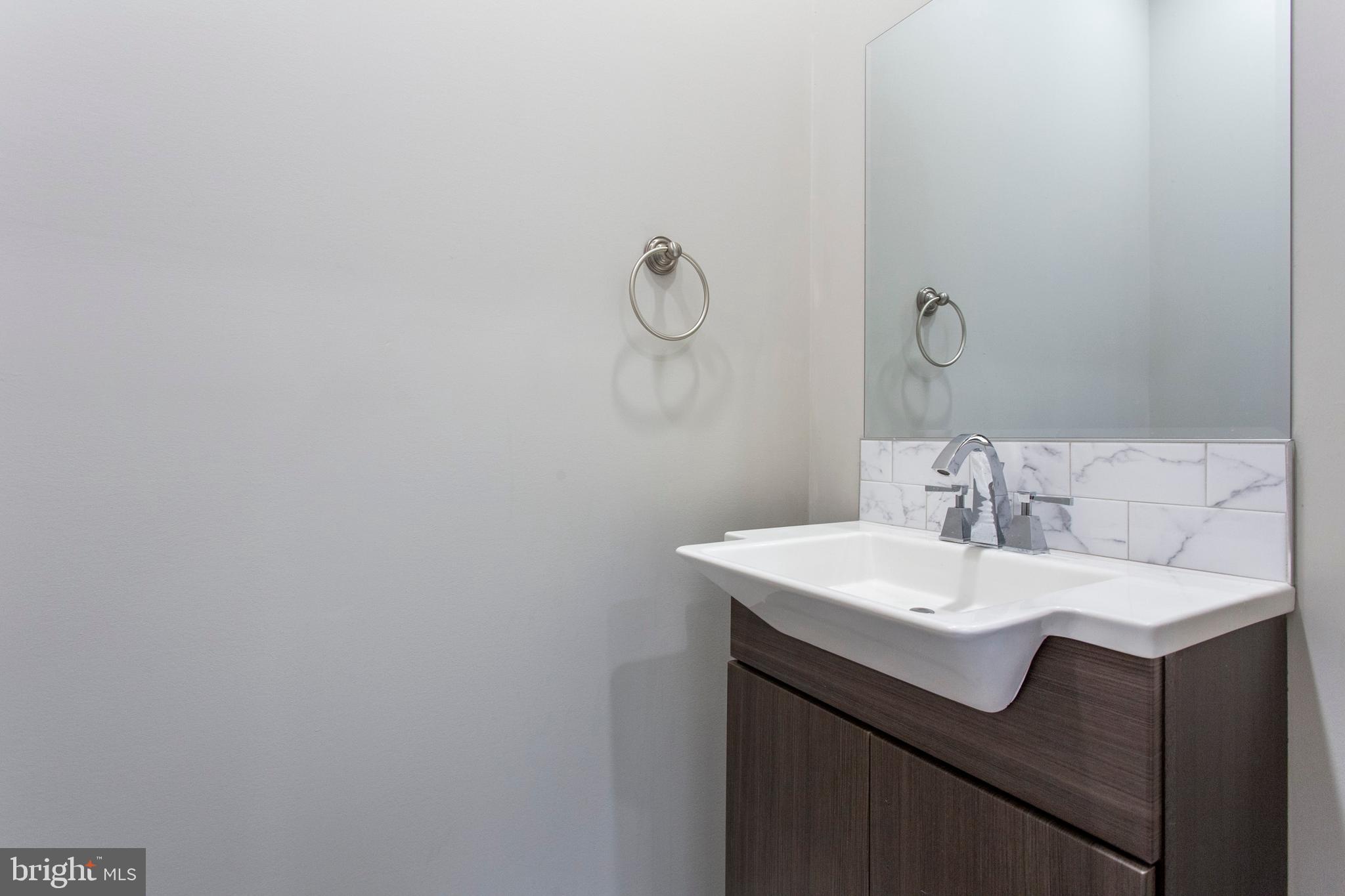 2052 Gerritt Street Philadelphia, PA 19146 - Photo 11 of 32 a bathroom with a sink and a mirror