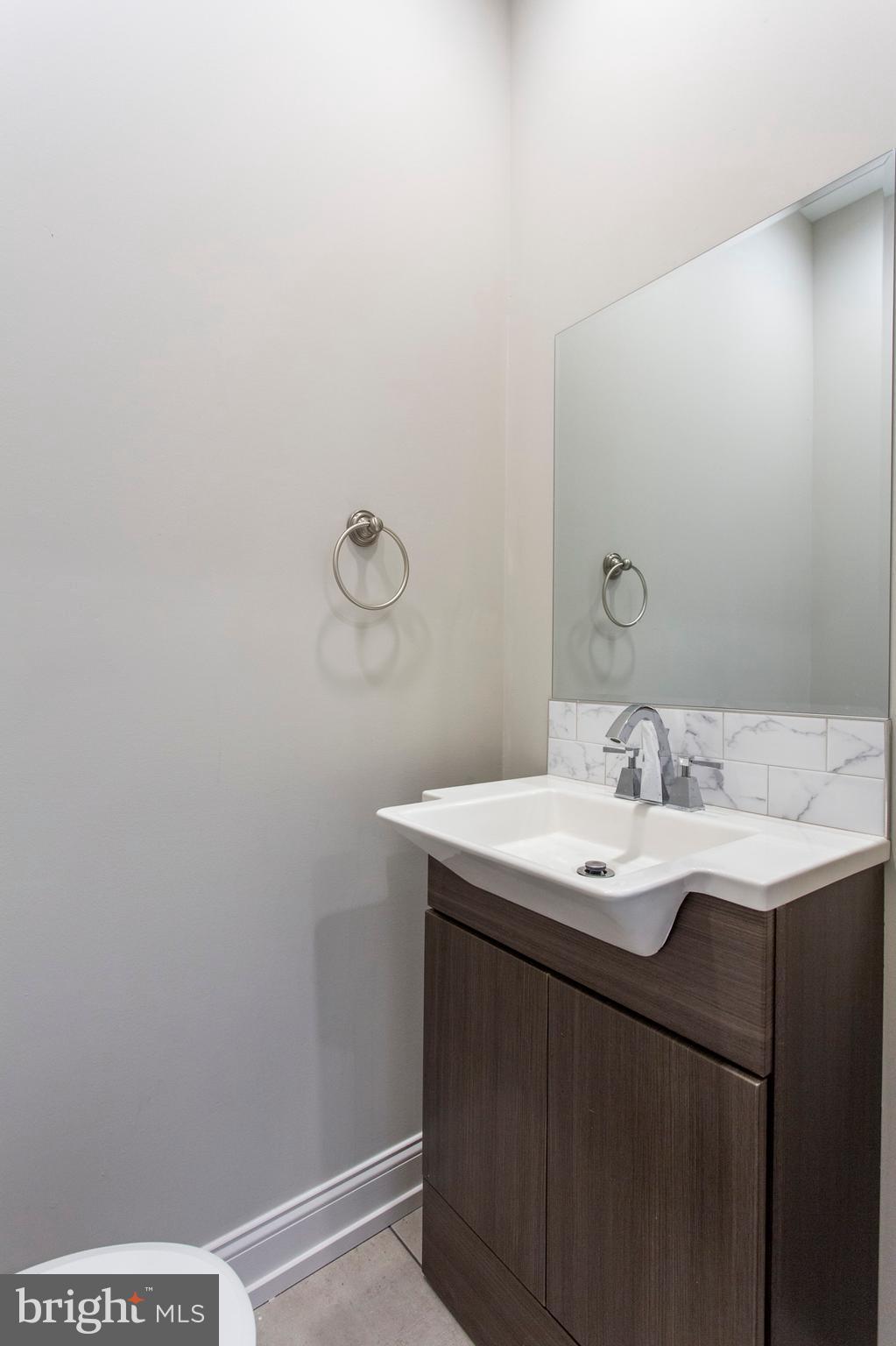 2052 Gerritt Street Philadelphia, PA 19146 - Photo 12 of 32 a bathroom with a sink and a mirror