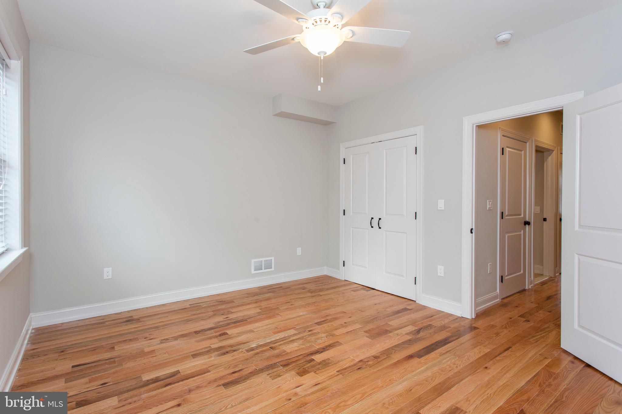2052 Gerritt Street Philadelphia, PA 19146 - Photo 18 of 32 an empty room with wooden floor and fan