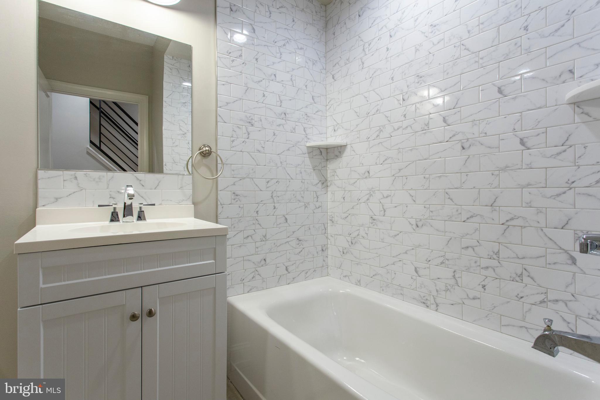 2052 Gerritt Street Philadelphia, PA 19146 - Photo 20 of 32 a bathroom with a sink a toilet and bathtub