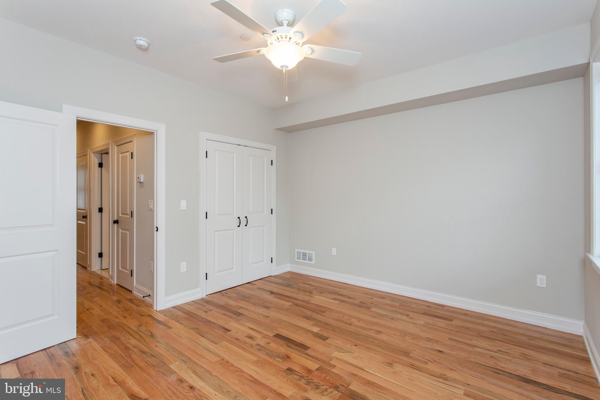 2052 Gerritt Street Philadelphia, PA 19146 - Photo 21 of 32 a view of a room with wooden floor and a ceiling fan