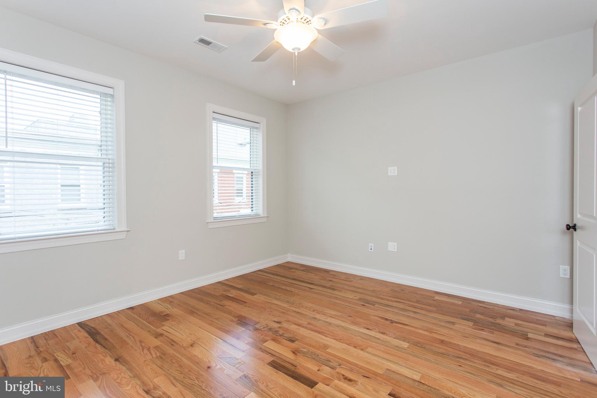 2052 Gerritt Street Philadelphia, PA 19146 - Photo 22 of 32 a view of empty room with wooden floor and fan
