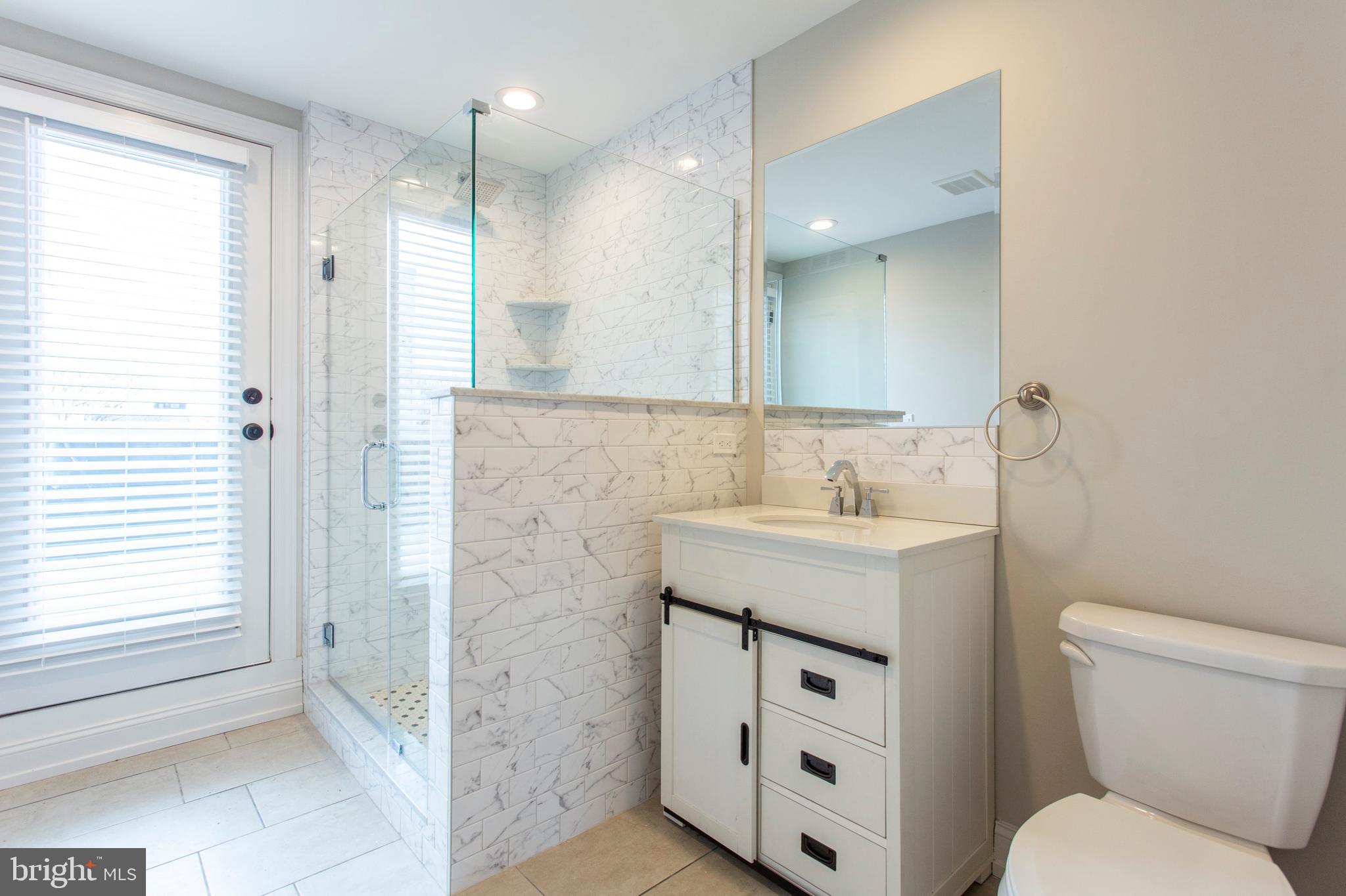 2052 Gerritt Street Philadelphia, PA 19146 - Photo 23 of 32 a bathroom with a granite countertop sink toilet and shower