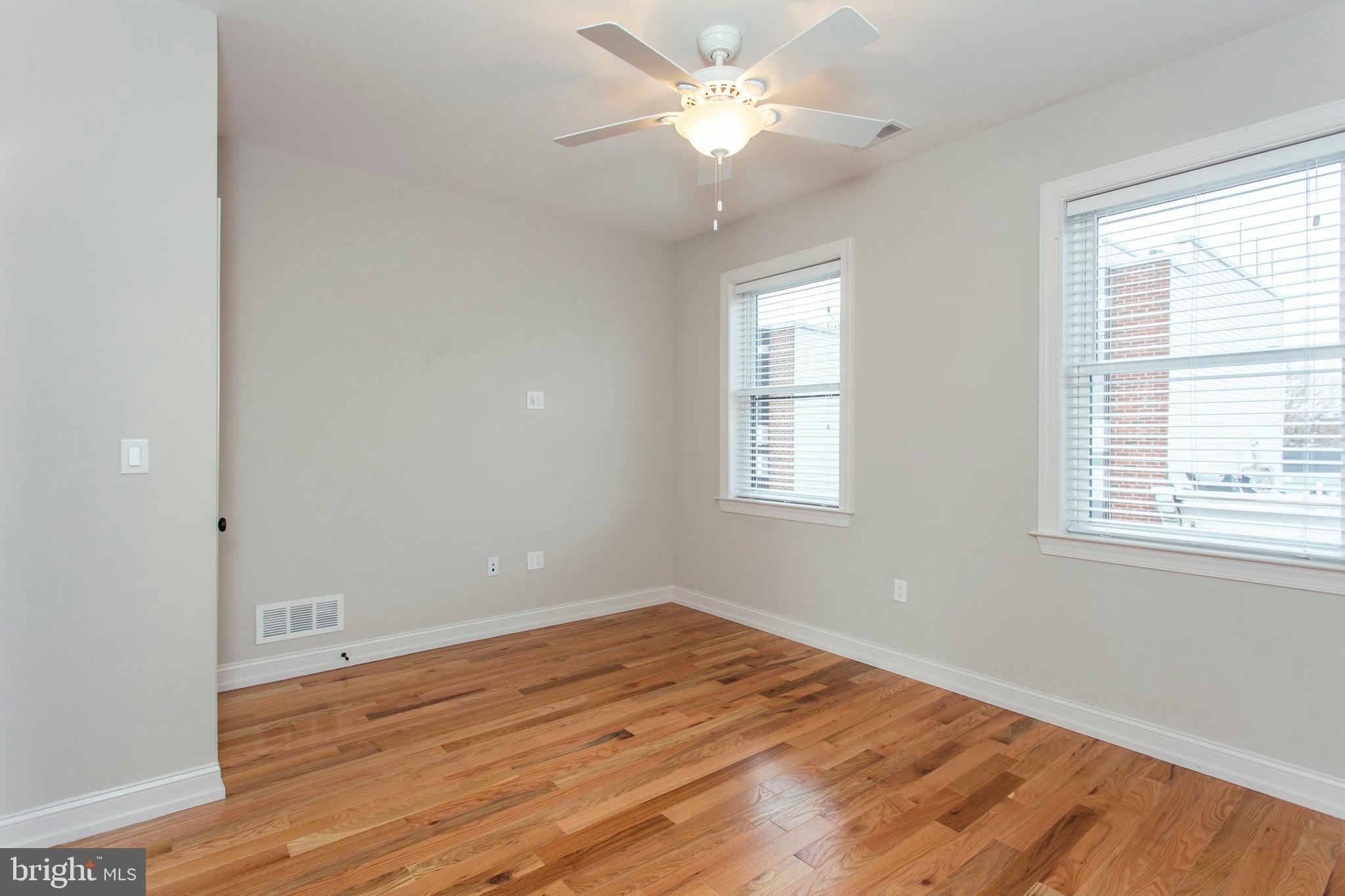 2052 Gerritt Street Philadelphia, PA 19146 - Photo 26 of 32 an empty room with wooden floor and windows