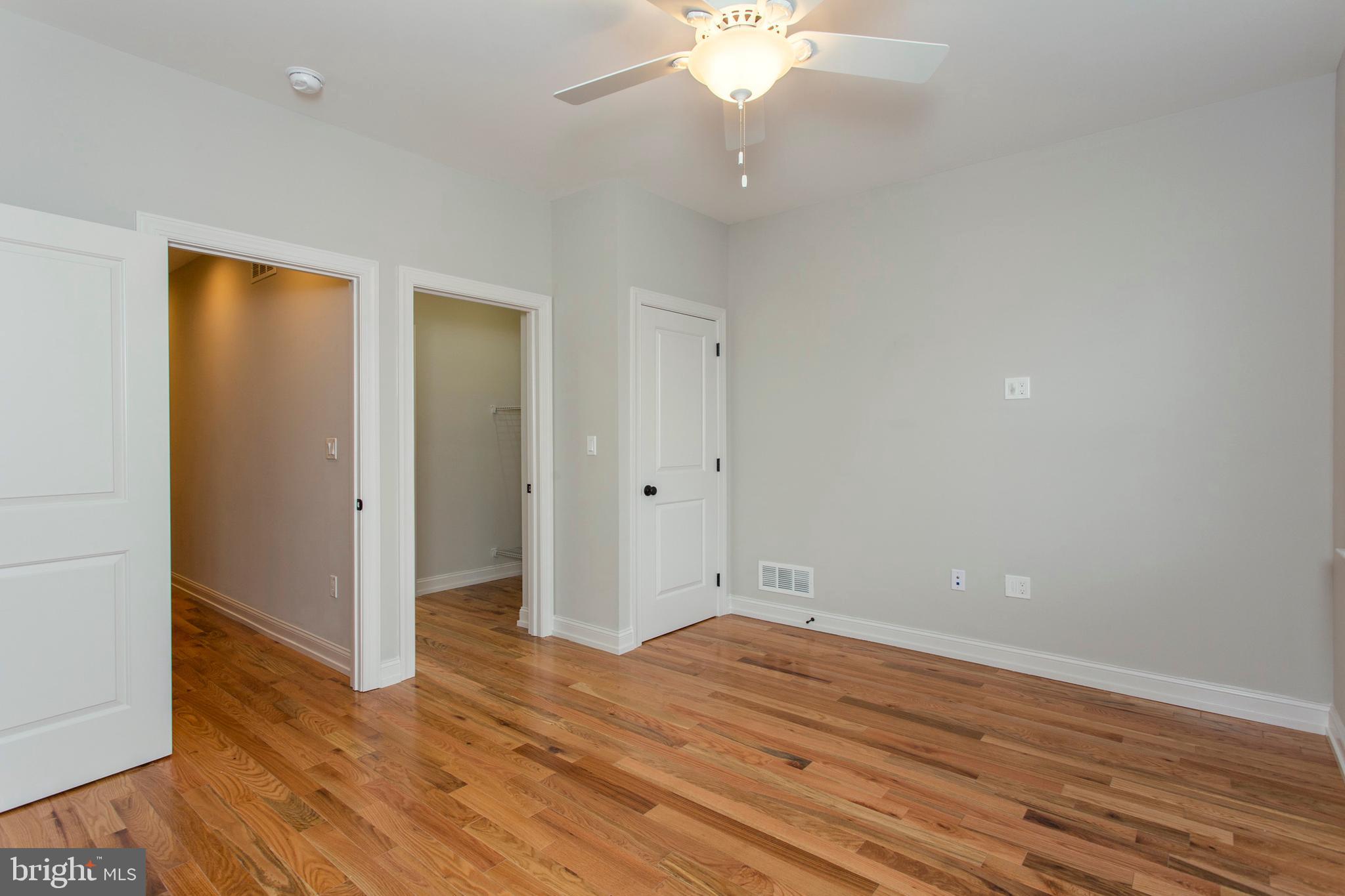 2052 Gerritt Street Philadelphia, PA 19146 - Photo 27 of 32 an empty room with wooden floor and fan