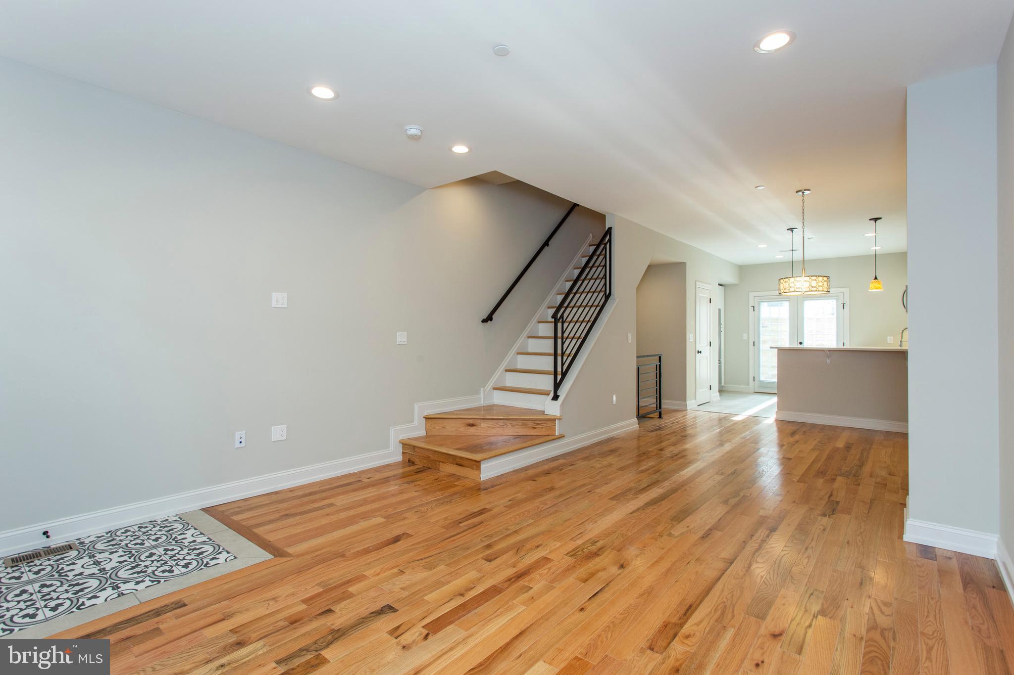 2052 Gerritt Street Philadelphia, PA 19146 - Photo 3 of 32 a view of a livingroom with wooden floor and stairs