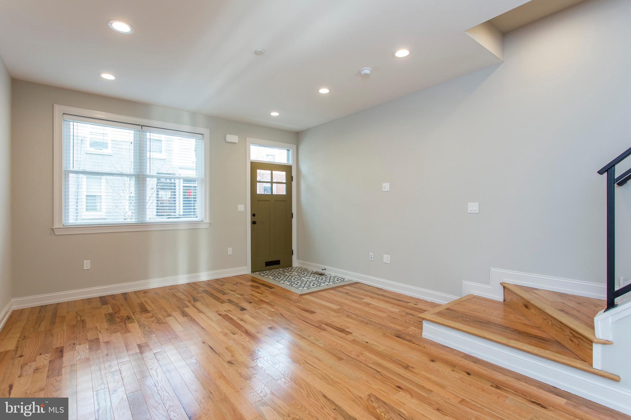 2052 Gerritt Street Philadelphia, PA 19146 - Photo 4 of 32 a view of empty room with wooden floor and fan