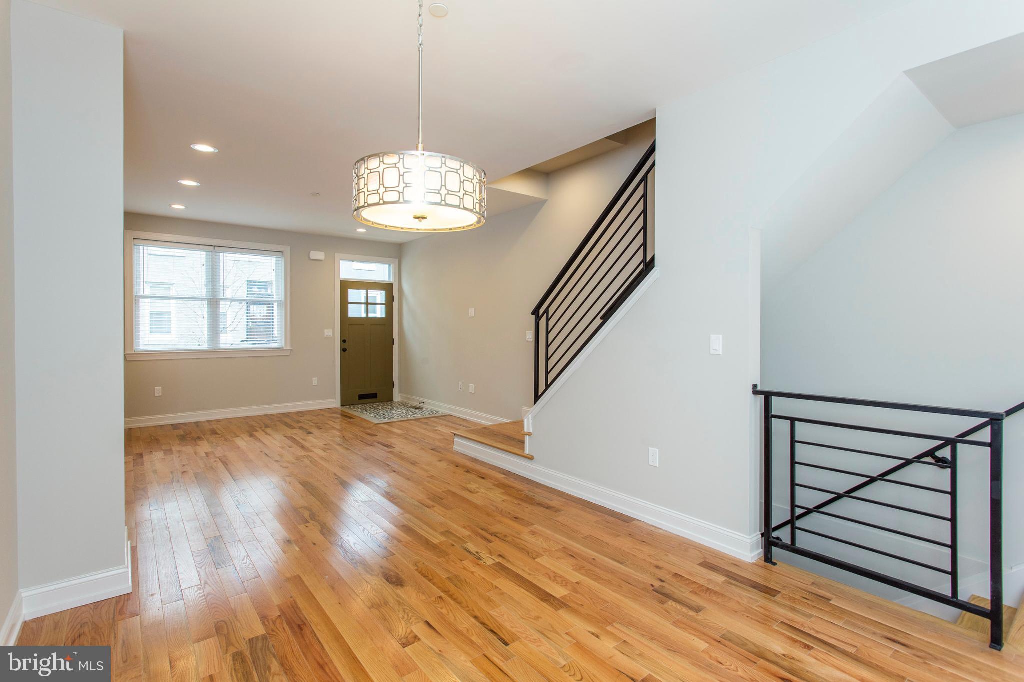 2052 Gerritt Street Philadelphia, PA 19146 - Photo 6 of 32 a view of an empty room with wooden floor and a window